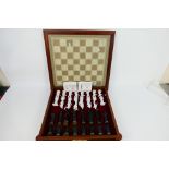 A Franklin Mint chess set, The Chess Set Of The Gods by Stuart Mark Feldman,