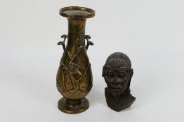 An Oriental bronze vase with twin fungus form handles, 20.