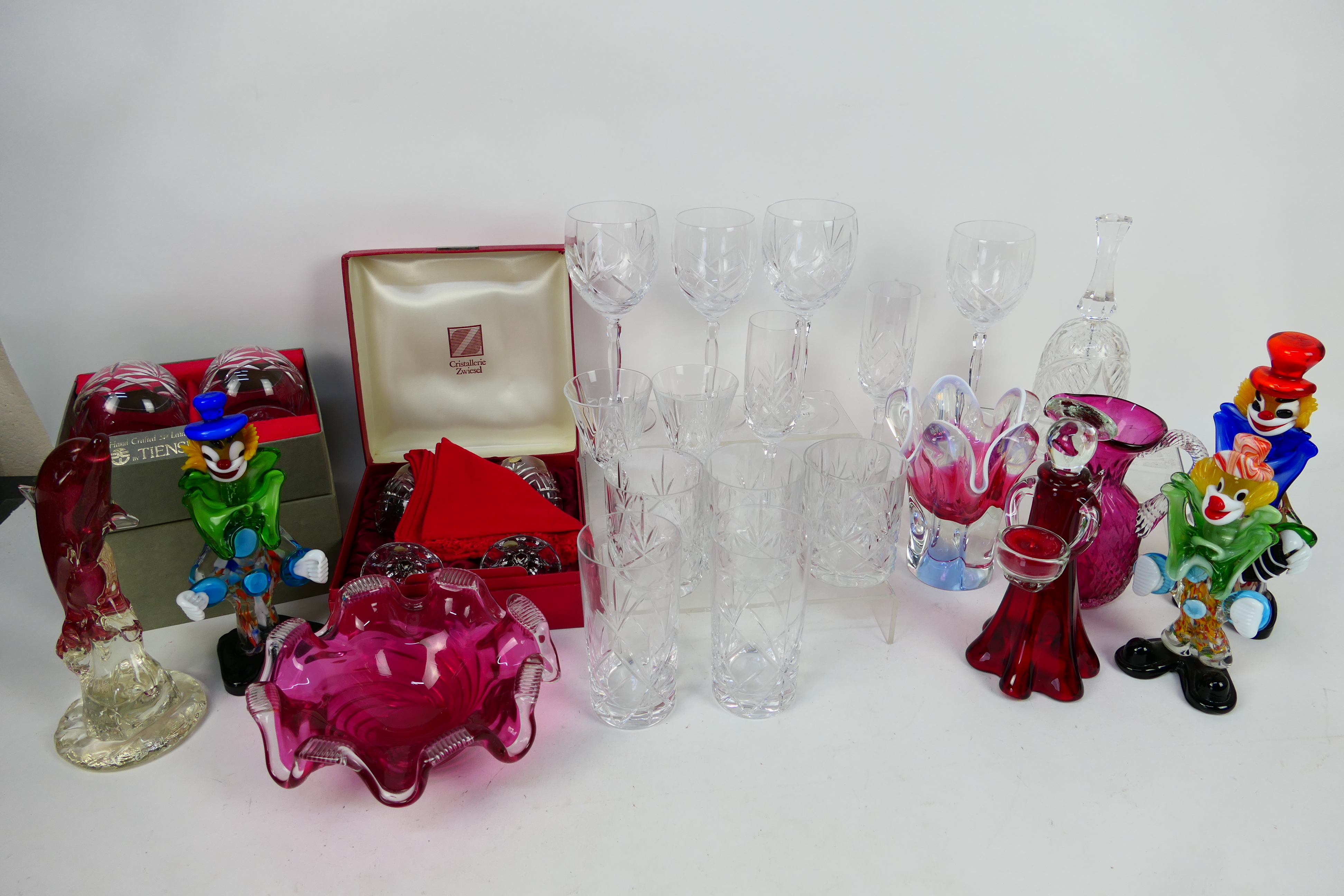 Lot to include Murano style clowns, crystal wine and similar glasses, cranberry glass and other,