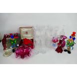 Lot to include Murano style clowns, crystal wine and similar glasses, cranberry glass and other,