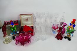 Lot to include Murano style clowns, crystal wine and similar glasses, cranberry glass and other,