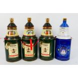 Four commemorative Bells whisky decanter