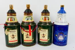 Four commemorative Bells whisky decanter