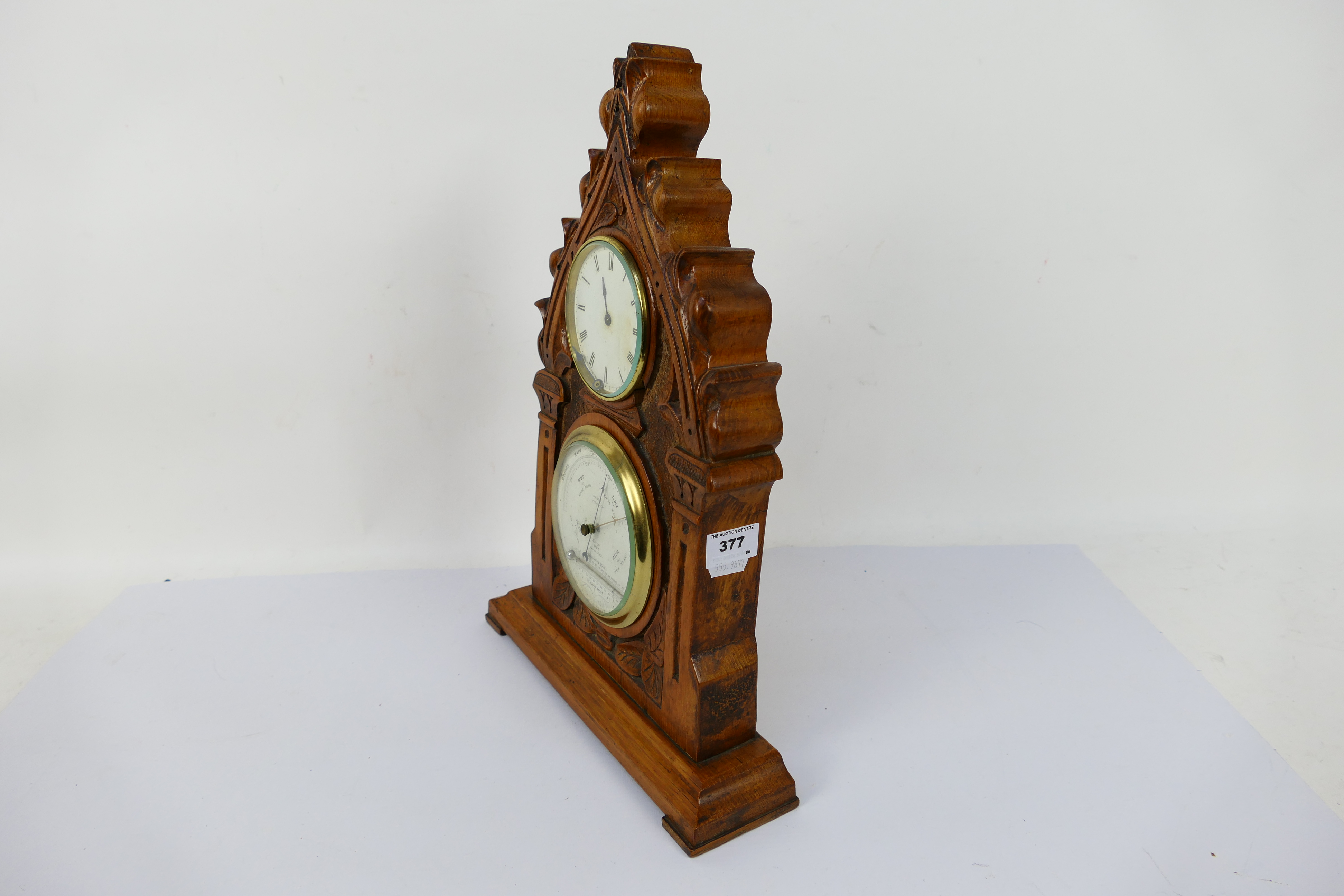 A vintage clock / barometer in wooden case, the case believed to be carved from a yew church pew, - Image 4 of 6
