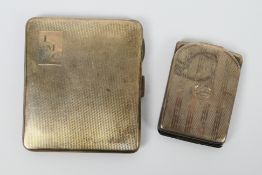 A silver cigarette case with engine turned decoration, Birmingham assay 1939 and a silver card case,