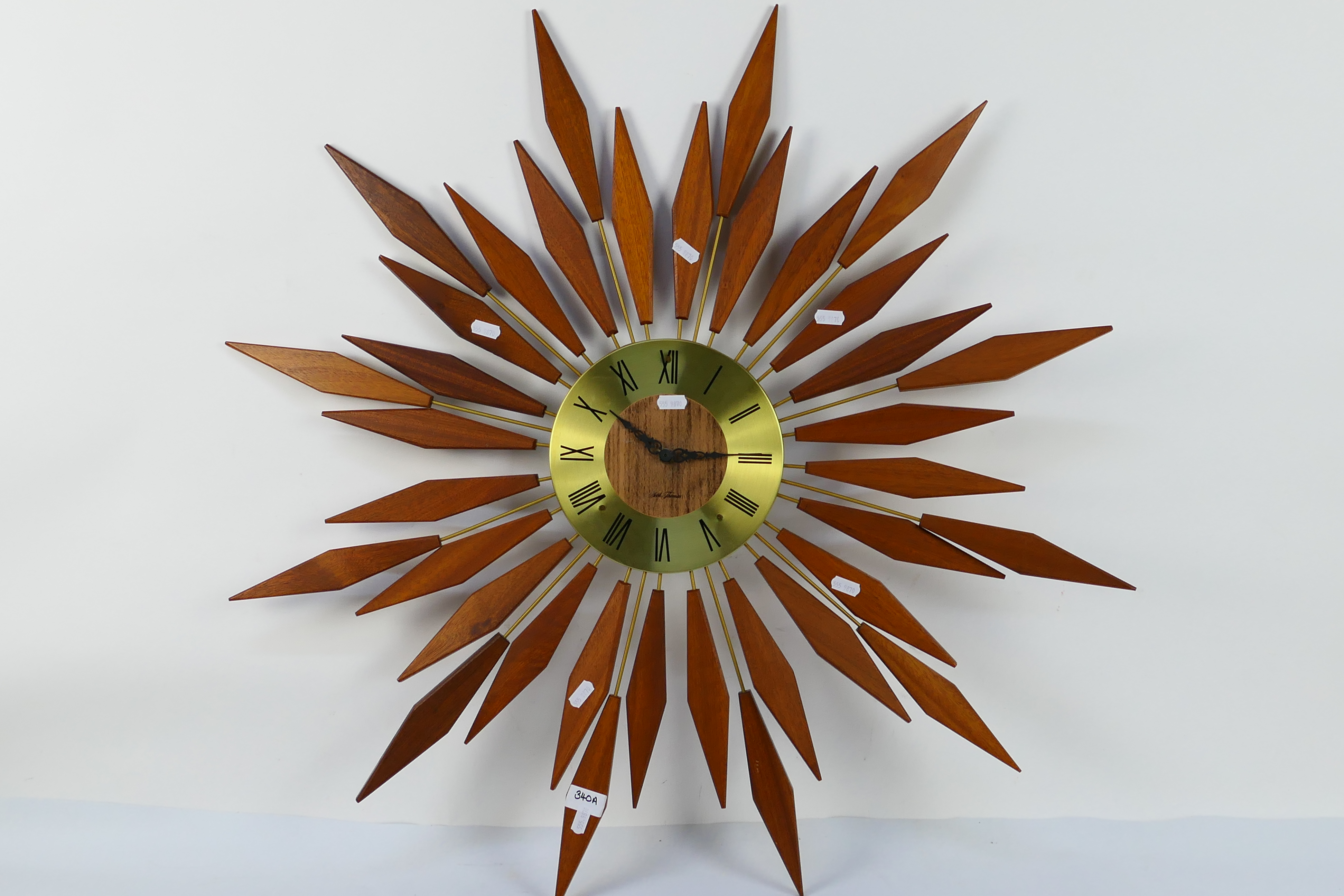 A Seth Thomas Sunburst wall clock, approximately 82 cm (d).