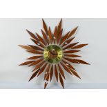 A Seth Thomas Sunburst wall clock, approximately 82 cm (d).