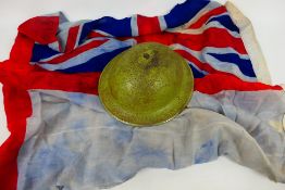 A World War Two (WW2 / WWII) Brodie helmet, dated 1939 and a white ensign,