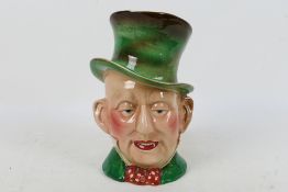 A large Beswick character jug, # 310, Mr Micawber, approximately 23 cm (h).