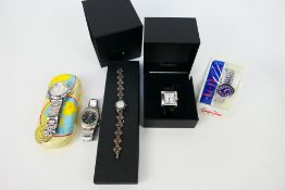 A collection of fashion wrist watches, part boxed.