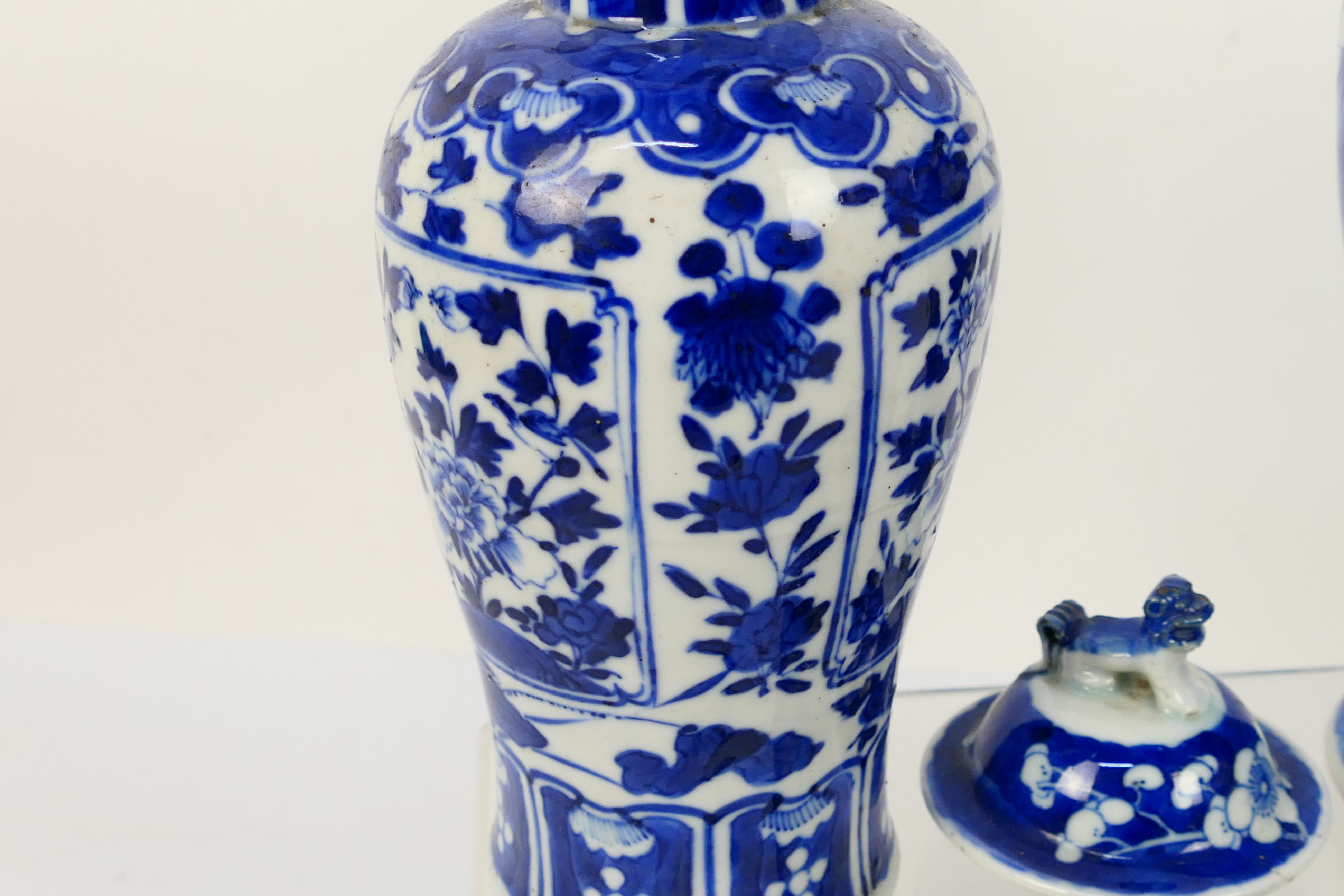 A group of 19th Century blue and white Chinese pottery covered vases of varying heights ranging - Image 5 of 36