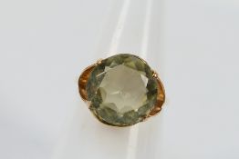 A 9ct yellow gold dress ring set with green Amethyst, size L, approx weight 2.