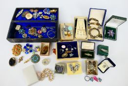 A quantity of costume jewellery to include brooches, earrings, ring and similar.