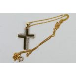 A 9 carat gold modern stone set crucifix pendant with 9 carat gold fine diamond cut curb chain,