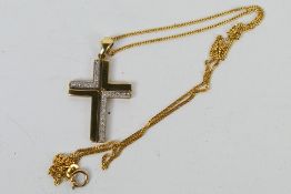 A 9 carat gold modern stone set crucifix pendant with 9 carat gold fine diamond cut curb chain,