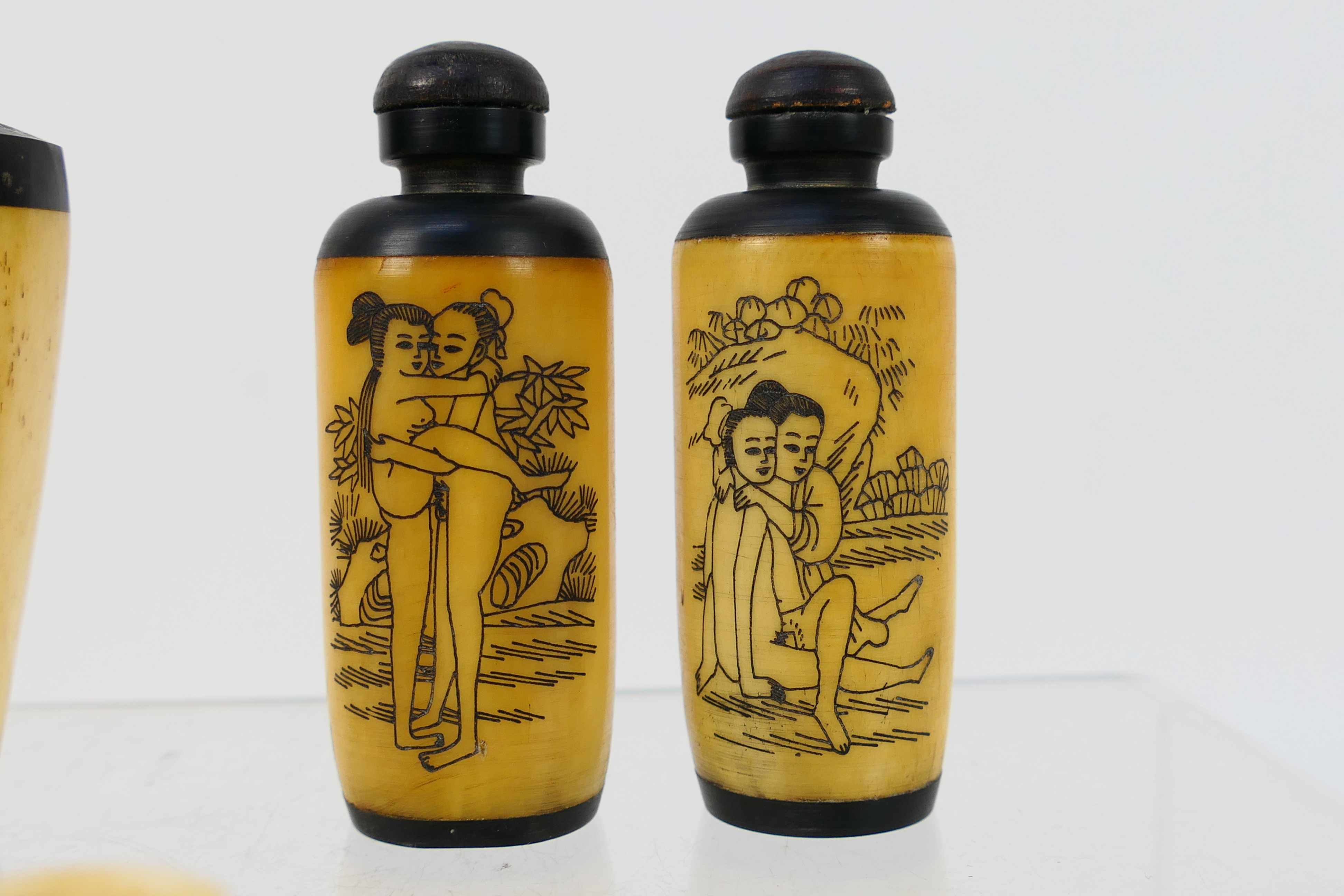 A grouping of bone and horn snuff bottles, four decorated with erotic scenes. [W]. - Image 5 of 7