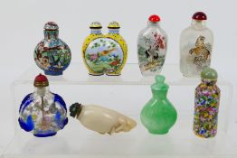 A collection of snuff bottles to include glass, ceramic, hardstone and other.