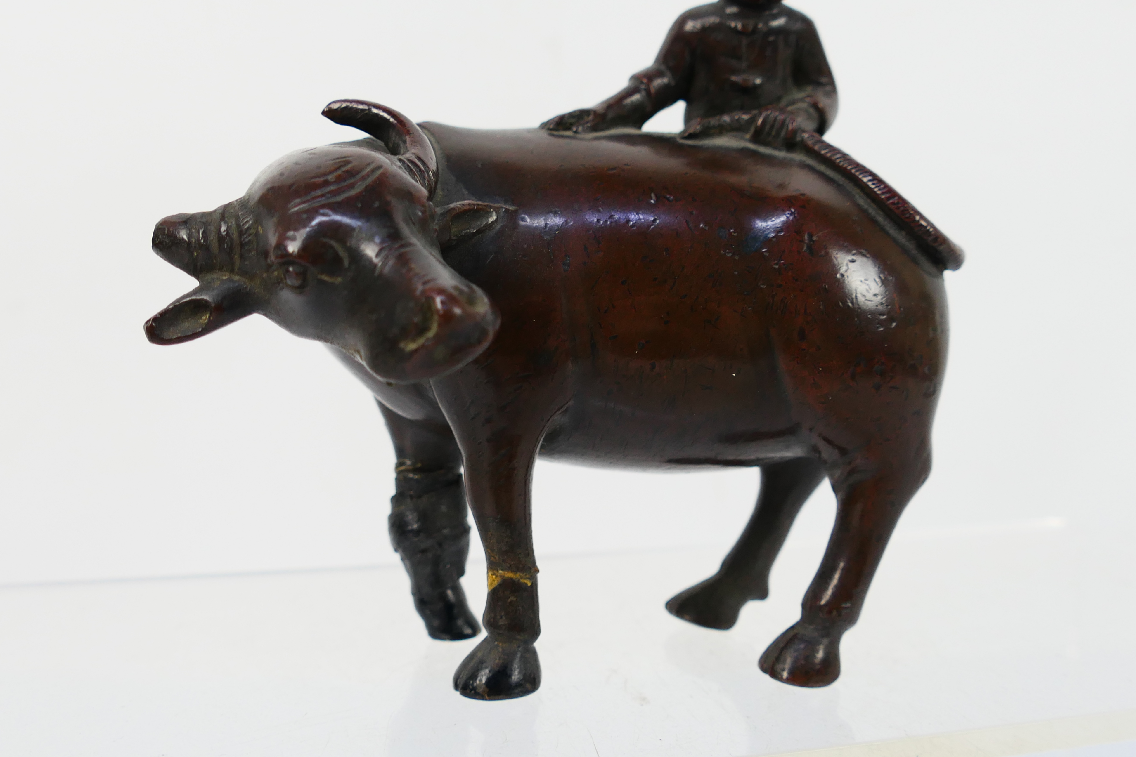 A Chinese bronze Buffalo and Boy group modelled as a boy atop a buffalo (A/F), - Image 3 of 4