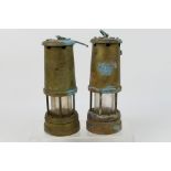 Two Lamp & Limelight Company miner's safety lamps, 22 cm (h) not including handle.