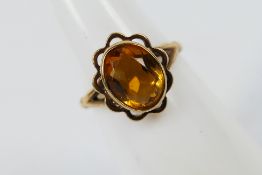 A hallmarked 9ct yellow gold ring set with one oval cut citrine, size K, approx weight 2.
