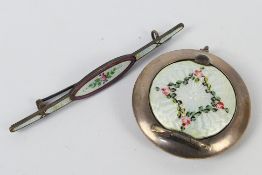 A small silver and enamel powder compact, 4.