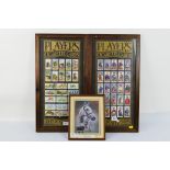 Two framed and glazed displays of John Player & Sons cigarette cards,