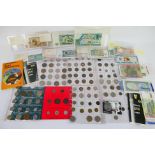 A quantity of UK and foreign coins and banknotes, some silver content noted.