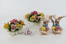 Decorative ceramics to include flower baskets and floral encrusted jugs, jugs 25 cm (h).