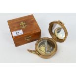 A natural sine brass cased compass with dual spirit level marked Stanley London with natural sine