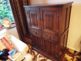 A carved oak storage unit,