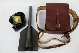 A military map case with belt, entrenching tool and belt.