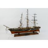 Model Ship - A three masted barque mounted to plinth, approximately 55 cm x 79 cm.