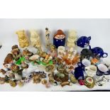 Two boxes of mixed ceramics to include Tetley Tea promotional wares, Wade, Flintstones figures,