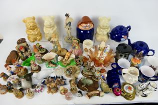 Two boxes of mixed ceramics to include Tetley Tea promotional wares, Wade, Flintstones figures,