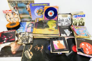 A quantity of 7" and 12" vinyl records to include The Beatles, The Rolling Stones, David Bowie,