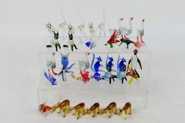 A collection of small glass animals, largest approximately 9 cm (h).
