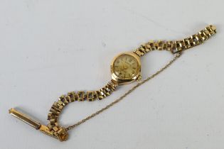 A lady's round 9ct yellow gold Everite bracelet watch with mechanical movement, approx weight 10.