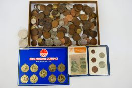 A collection of coins, decimal coin set and a 1980 Olympics medal collection.