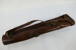 An antique leather gun slip case or spare barrel case, 65 cm (l).