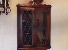 Old Charm Furniture - a Hanging Corner Cabinet having leaded light windows opening to reveal a