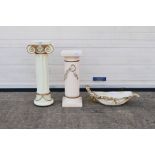 A decorative ceramic centrepiece, approximately 58 cm (l) and two jardiniere stands,