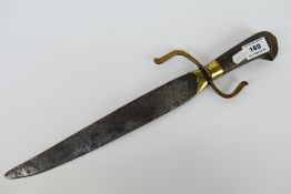 A southern Chinese Hudiedao or butterfly knife, brass mounted wooden grip,