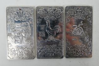 Three Chinese white metal trade tokens / plaques with zodiac decoration to each side,