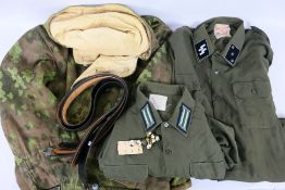 Two World War Two (WW2 / WWII) style German military shirts bearing insignia and other.