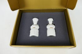Lladro - A boxed set of Privilege Gold salt and pepper pots in the form of young monks,