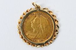 A Gold half Sovereign - Victoria c 1899 in yellow metal mount, the mount presumed 9ct,