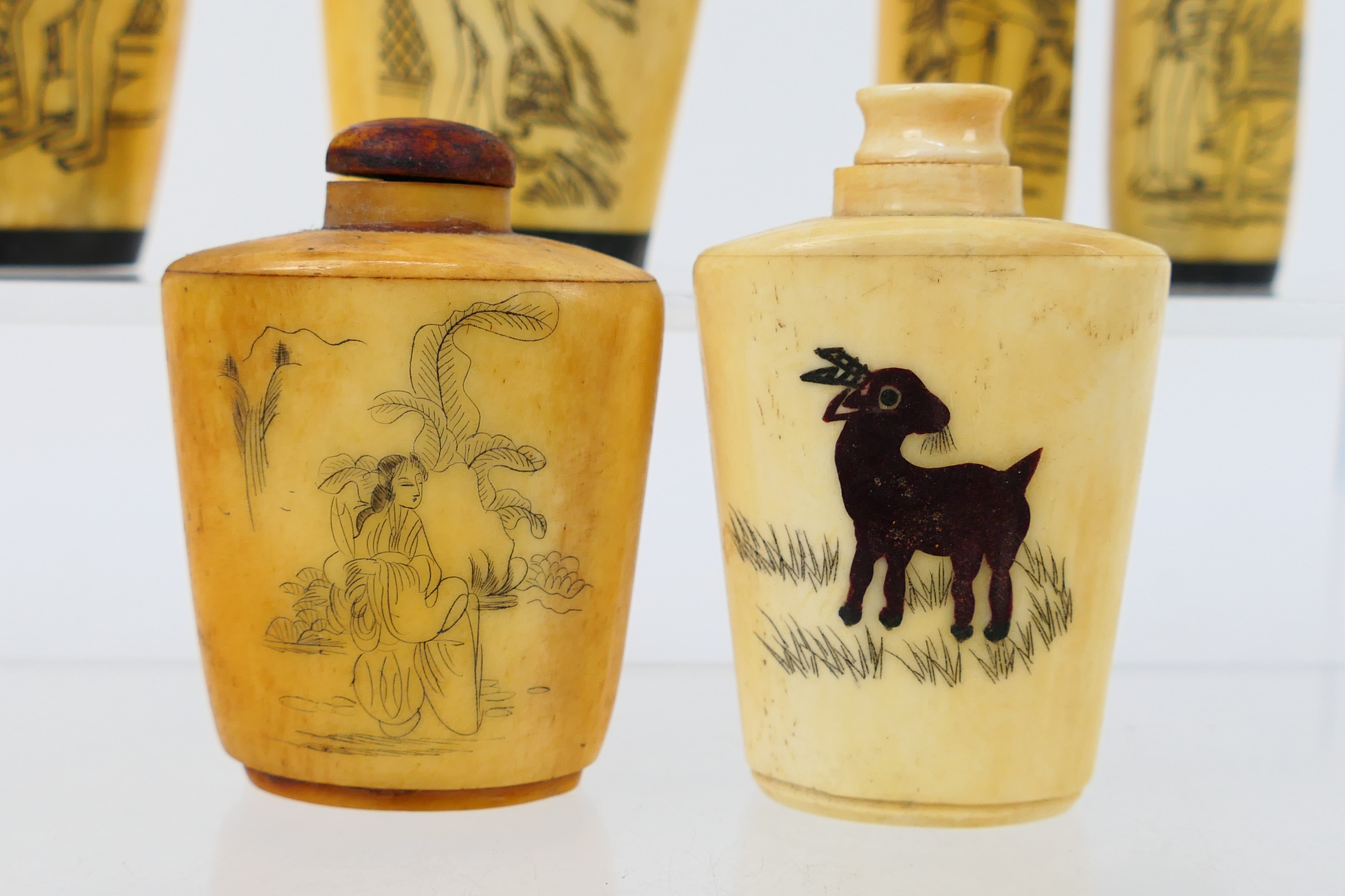 A grouping of bone and horn snuff bottles, four decorated with erotic scenes. [W]. - Image 7 of 7