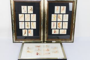 A quantity of 21st Century Archives Varga trading cards housed in three framed displays,
