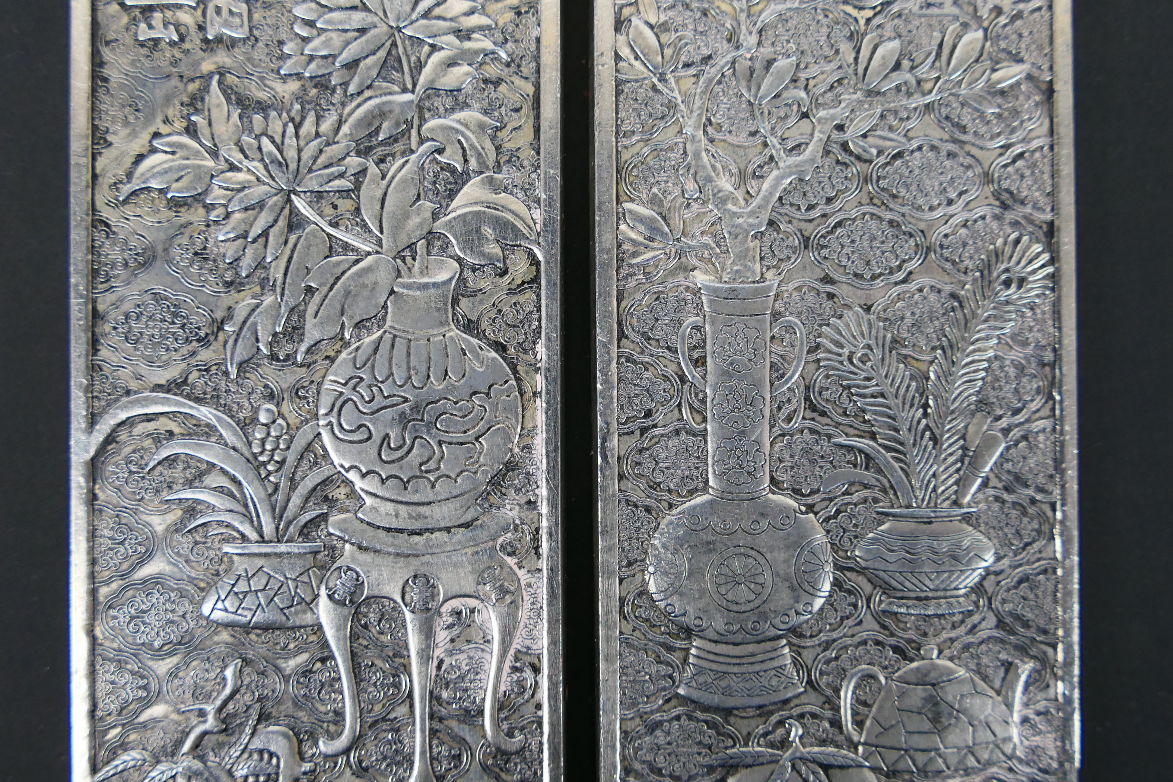 A pair of Chinese white metal plaques having bogu pattern decoration, 15 cm x 4.5 cm. - Image 3 of 7