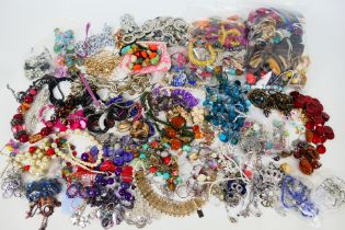 A collection of various costume jewellery, predominantly necklaces.